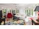 Bright living room with bay windows, colorful rug and comfortable seating at 34 Formosa Dr, Charleston, SC 29407