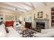 Bright living room with beamed ceiling, fireplace, and stylish furnishings creating a comfortable atmosphere at 34 Formosa Dr, Charleston, SC 29407