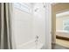 Bright bathroom with subway tile, white fixtures and shower-tub combo at 3413 Acorn Drop Ln, Johns Island, SC 29455