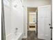 Bright bathroom with subway tile, white fixtures and shower-tub combo at 3413 Acorn Drop Ln, Johns Island, SC 29455