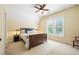 Cozy bedroom featuring a ceiling fan, a bed, and bright natural light from a window at 3413 Acorn Drop Ln, Johns Island, SC 29455