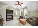 Cozy bedroom with bookshelves, ceiling fan, and ample natural light at 3413 Acorn Drop Ln, Johns Island, SC 29455