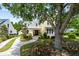 Beautiful yellow home with well-manicured lawn and mature trees at 3413 Acorn Drop Ln, Johns Island, SC 29455