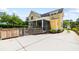 Exterior view of the charming yellow house and well maintained side yard at 3413 Acorn Drop Ln, Johns Island, SC 29455