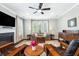 Inviting living room with a fireplace, ceiling fan, and comfortable seating arrangement at 3413 Acorn Drop Ln, Johns Island, SC 29455