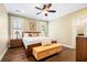 Bright main bedroom with hardwood floors, a ceiling fan, neutral walls, and plantation shutters at 3413 Acorn Drop Ln, Johns Island, SC 29455