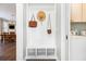 Mud room with storage hooks, built in bench, and easy access to laundry room and dining area at 3413 Acorn Drop Ln, Johns Island, SC 29455