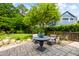 Outdoor patio featuring a table and chairs with access to a lush backyard and garden at 3413 Acorn Drop Ln, Johns Island, SC 29455