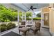 Relaxing screened-in porch with an inviting seating area and views of the lush landscape at 3413 Acorn Drop Ln, Johns Island, SC 29455
