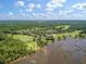 Panoramic aerial view featuring the community, golf course, clubhouse, and stunning waterfront access at 3601 Colonel Vanderhorst Cir, Mount Pleasant, SC 29466