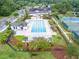 Aerial view of the community pool, clubhouse, tennis courts, and surrounding greenery at 3601 Colonel Vanderhorst Cir, Mount Pleasant, SC 29466