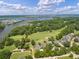 Scenic aerial featuring golf course, river, neighborhood homes, and waterfront of the community at 3601 Colonel Vanderhorst Cir, Mount Pleasant, SC 29466