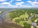 Expansive aerial perspective highlighting the golf course, waterway, and lush landscaping of the community at 3601 Colonel Vanderhorst Cir, Mount Pleasant, SC 29466