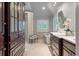 Elegant bathroom with marble countertops, cabinets, a standalone tub, and a glass shower at 3601 Colonel Vanderhorst Cir, Mount Pleasant, SC 29466