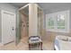 Modern bathroom features a glass shower, standalone tub, and vanity with great light at 3601 Colonel Vanderhorst Cir, Mount Pleasant, SC 29466