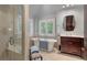 Luxurious bathroom with a glass shower, standalone tub, and stylish vanity area at 3601 Colonel Vanderhorst Cir, Mount Pleasant, SC 29466