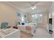 Bright bedroom featuring twin beds, neutral carpet, white trim, and natural light from the windows at 3601 Colonel Vanderhorst Cir, Mount Pleasant, SC 29466