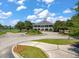 Aerial view of the community clubhouse with well-maintained landscaping and roundabout driveway at 3601 Colonel Vanderhorst Cir, Mount Pleasant, SC 29466