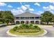 Beautiful clubhouse entrance featuring circle driveway with flower display and attractive architecture at 3601 Colonel Vanderhorst Cir, Mount Pleasant, SC 29466
