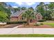 Beautiful brick home featuring manicured landscaping and a circular driveway for added curb appeal at 3601 Colonel Vanderhorst Cir, Mount Pleasant, SC 29466