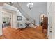 Grand foyer with a curved staircase, hardwood floors, and elegant chandelier at 3601 Colonel Vanderhorst Cir, Mount Pleasant, SC 29466