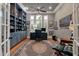 Spacious home office with custom built-in bookshelves and plenty of natural light at 3601 Colonel Vanderhorst Cir, Mount Pleasant, SC 29466