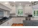 Bright kitchen features white cabinetry, granite countertops and stainless steel appliances at 3601 Colonel Vanderhorst Cir, Mount Pleasant, SC 29466