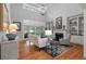 Well-lit living room with vaulted ceiling, fireplace, built-ins and backyard views at 3601 Colonel Vanderhorst Cir, Mount Pleasant, SC 29466