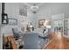 Spacious living room with fireplace, hardwood floors, and seamless flow to the dining area at 3601 Colonel Vanderhorst Cir, Mount Pleasant, SC 29466