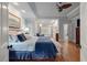 Spacious main bedroom featuring a sitting area, tray ceilings, and hardwood floors at 3601 Colonel Vanderhorst Cir, Mount Pleasant, SC 29466