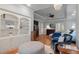 Open-concept main bedroom with a sitting area, bookshelf, and stylish decor at 3601 Colonel Vanderhorst Cir, Mount Pleasant, SC 29466