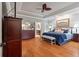 Spacious main bedroom featuring hardwood floors, tray ceilings, and a view to the ensuite bathroom at 3601 Colonel Vanderhorst Cir, Mount Pleasant, SC 29466