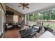 Relaxing screened-in porch with comfortable seating and serene views of the surrounding landscape at 3601 Colonel Vanderhorst Cir, Mount Pleasant, SC 29466
