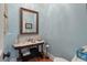 Charming powder room with unique sink and mirror at 3601 Colonel Vanderhorst Cir, Mount Pleasant, SC 29466