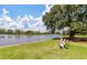 Scenic waterfront view featuring Adirondack chairs overlooking the tranquil water and lush greenery at 3601 Colonel Vanderhorst Cir, Mount Pleasant, SC 29466