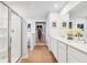 Elegant bathroom featuring double vanity, walk-in shower with glass enclosure, and convenient access to a walk-in closet at 4147 Rising Tide Dr, Summerville, SC 29485