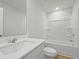 Spotless bathroom featuring a sleek vanity with a large mirror and a shower-tub combo with white tile surround at 4147 Rising Tide Dr, Summerville, SC 29485