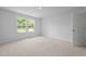 Bedroom featuring plush carpet and two windows with natural light at 4147 Rising Tide Dr, Summerville, SC 29485