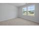 Inviting bedroom with two windows offering a bright and airy space with views of the neighborhood at 4147 Rising Tide Dr, Summerville, SC 29485