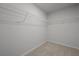 Bright closet featuring white wire shelving and neutral carpeting, ideal for storage solutions at 4147 Rising Tide Dr, Summerville, SC 29485