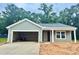 Charming gray home with open garage, covered entrance, and well-lit window at 4147 Rising Tide Dr, Summerville, SC 29485