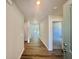 Bright hallway with hardwood floors leads to various rooms in the house at 4147 Rising Tide Dr, Summerville, SC 29485