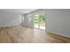 Bright living area with sliding glass doors that offers natural light and access to the backyard at 4147 Rising Tide Dr, Summerville, SC 29485