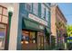 Charming O'Lacy's Pub featuring historic architecture, green awnings, Budweiser signage, and inviting atmosphere in a lively neighborhood at 4147 Rising Tide Dr, Summerville, SC 29485