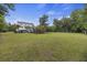 Expansive lawn featuring a playground and volleyball net, framed by mature trees and lush greenery at 4205 Cobble Trot Way, Johns Island, SC 29455