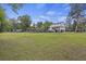 Lush backyard with recreational amenities, including a volleyball net and playground, perfect for outdoor activities at 4205 Cobble Trot Way, Johns Island, SC 29455