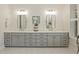 Elegant bathroom with gray double vanity, marble countertop, white shiplap, and modern fixtures at 4205 Cobble Trot Way, Johns Island, SC 29455