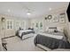 Spacious bedroom with two beds, french doors, an area for a piano, and neutral colored carpet at 4205 Cobble Trot Way, Johns Island, SC 29455