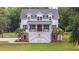 Charming two-story home with a welcoming porch and a beautifully landscaped front yard at 4205 Cobble Trot Way, Johns Island, SC 29455