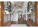Elegant foyer showcasing a staircase, hardwood floors, and tasteful decorations, creating an inviting entrance at 4205 Cobble Trot Way, Johns Island, SC 29455